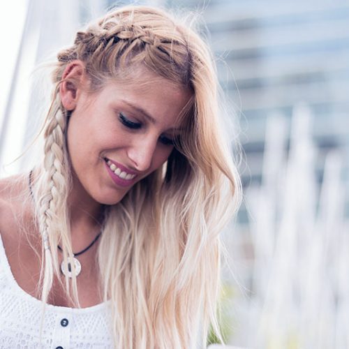 happy-beautiful-blonde-woman-smiling-looking-at-4GABJRD.jpg